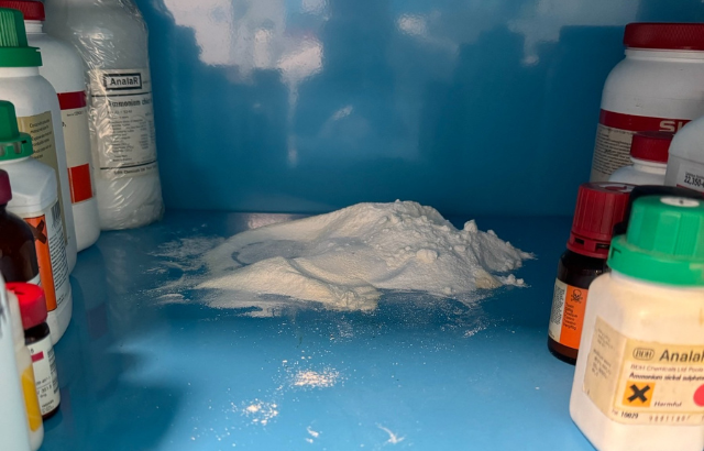 Loose white powder in a chemical cabinet