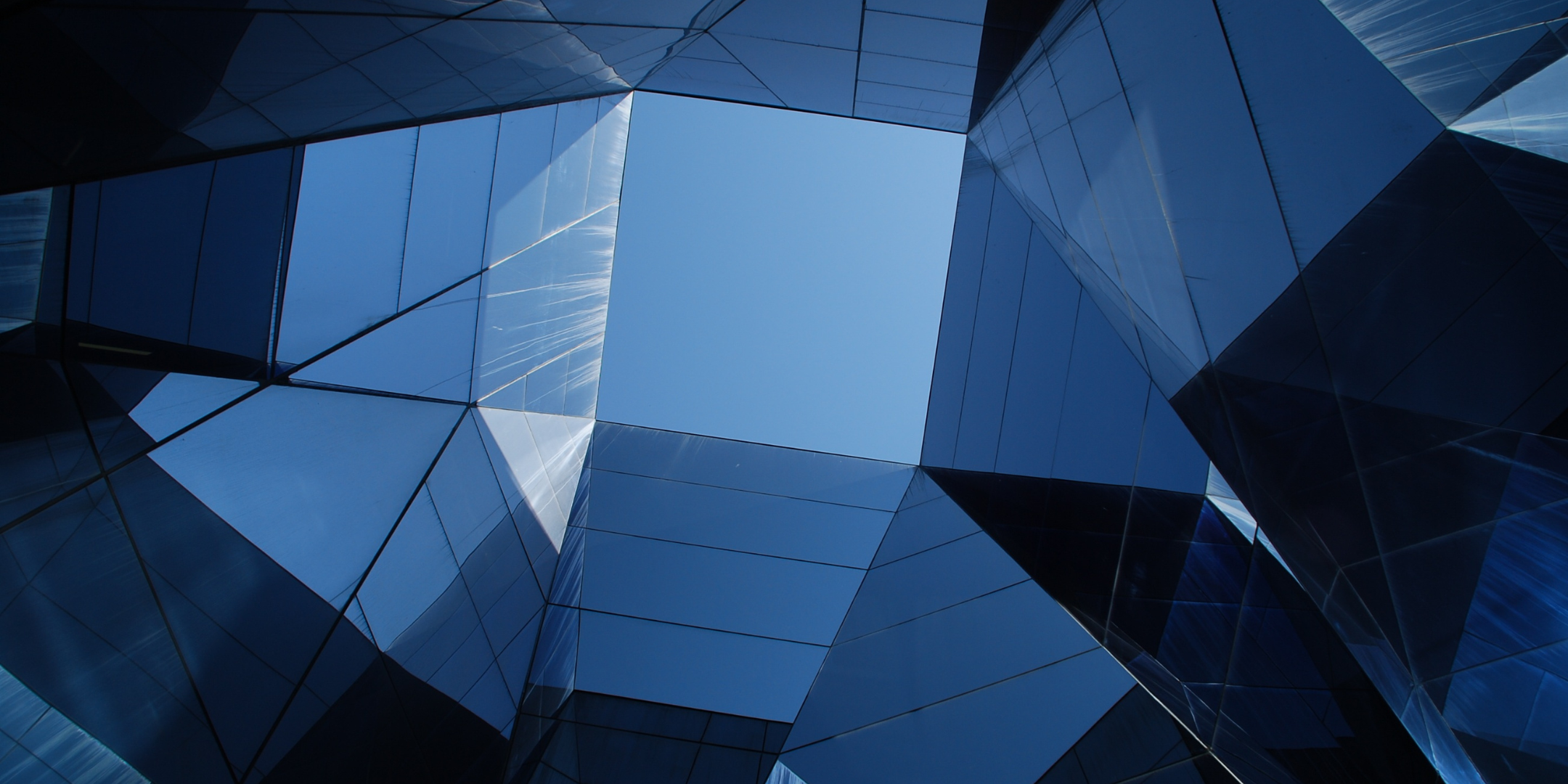 Photo looking up at buildings and sky