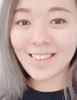 Asian woman with long blond hair