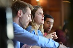 three people talking at the table