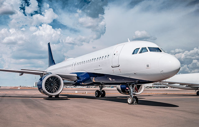 A passenger airplane sat on a runway.