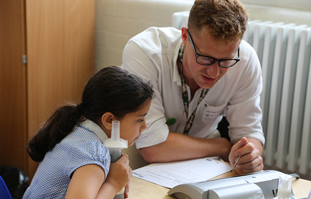 A girl from Netley Primary School has her lung capacity measured.