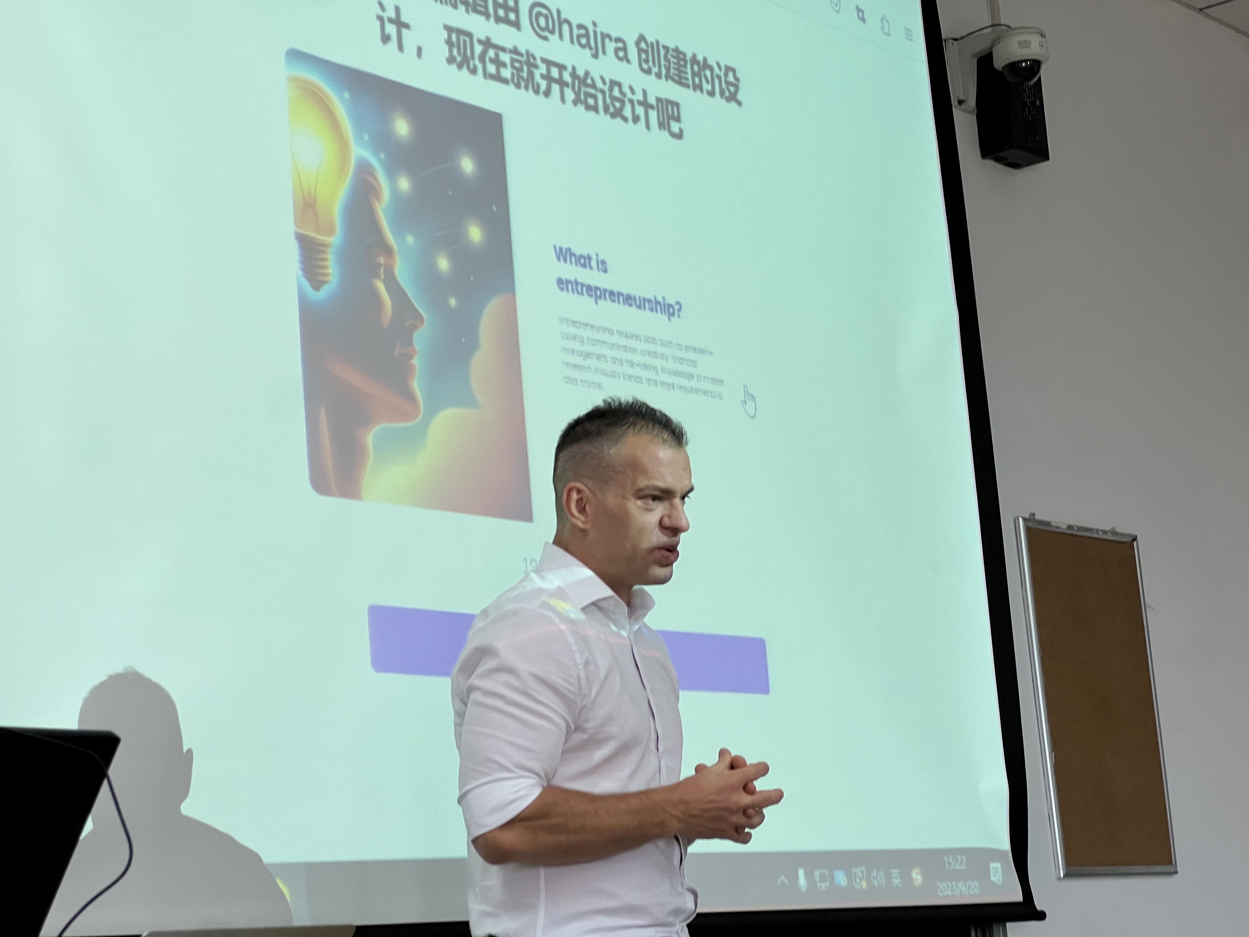 Hajre presenting in the talk