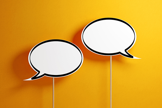 Two speech bubbles on an orange background