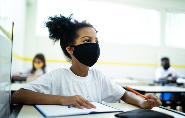 A child pays attention in a classroom
