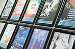 Posters of projects offered by the LAC hanging on the wall