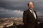Neil MacCormick against the backdrop of a city