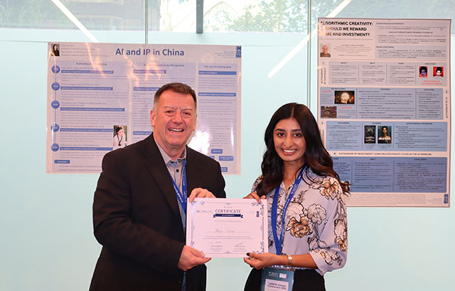 Lee Davies (Chief Executive of CIPA) handing the certificate for first prize to winner Zoya Yousef (University of Cambridge).