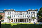 The exterior of the Queens' Building in the sunshine.