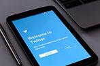 A tablet with the Twitter registration screen