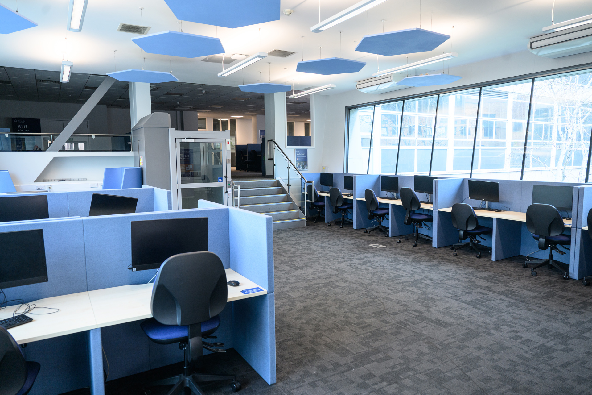 Rows of study desks with PCs