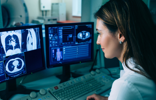 Radiologist reading a CT scan. Credit:peakSTOCK/iStock.com