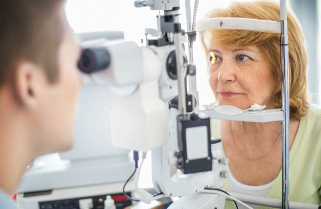 Elderly woman receiving an eye examination. Credit: Gilaxia/iStock.com