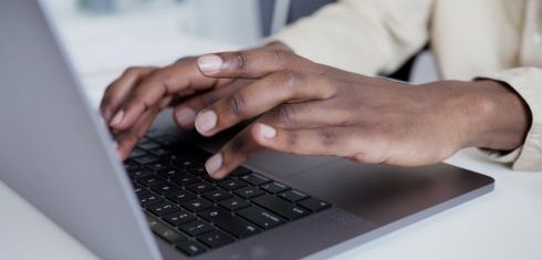 Hands on a laptop