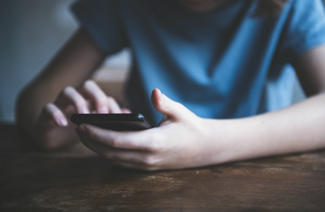 boy using phone