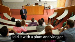 Screen shot of a Lecturer teaching with  dubious closed captions